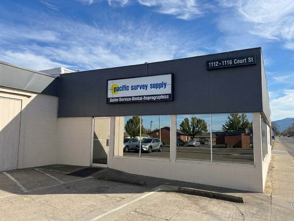 Pacific Survey Supply building with clear sky and mountains in the background